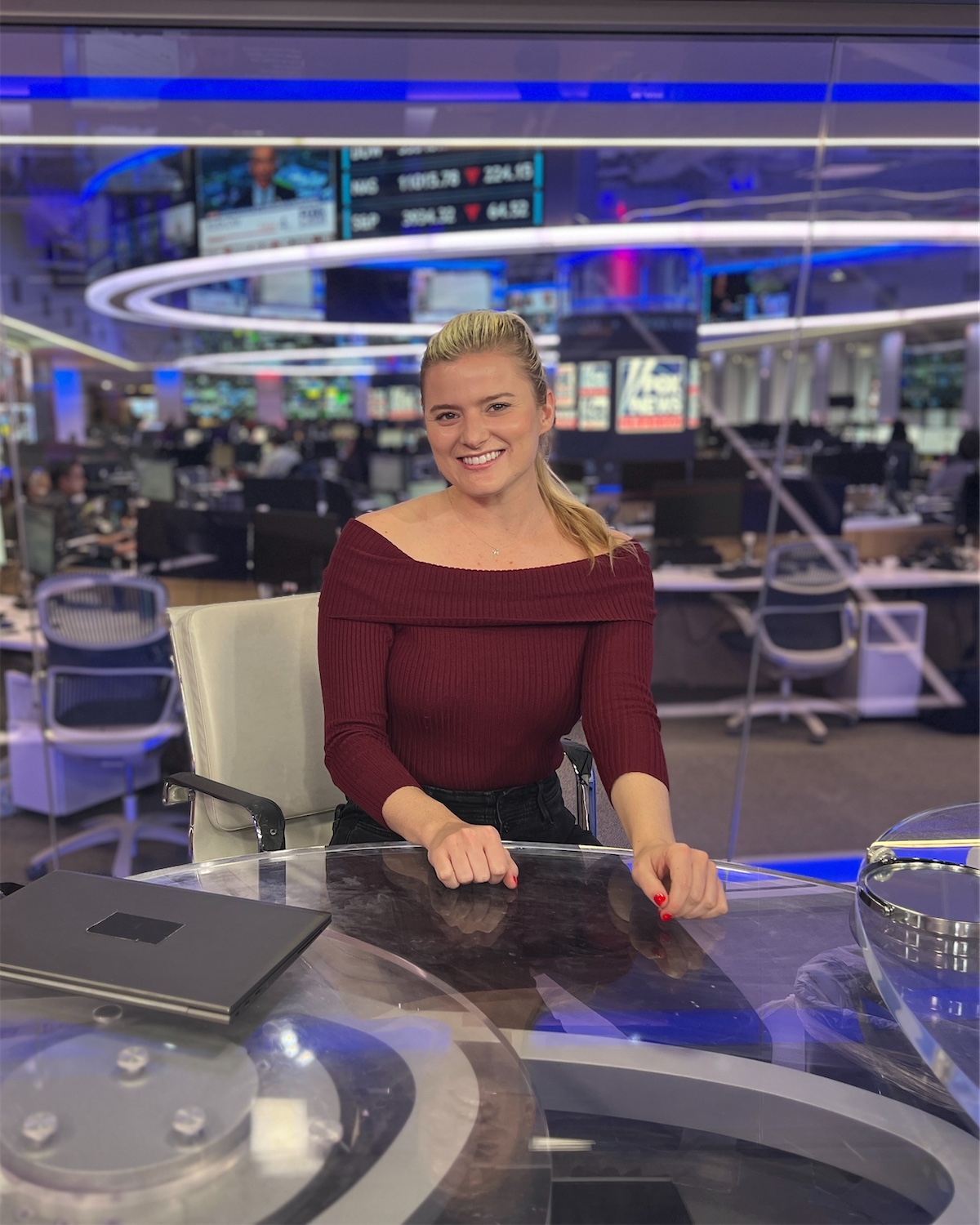 Daytona Everett at an anchor desk in a television newsroom