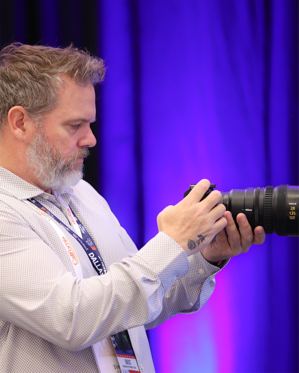 Trevor Lewis checking a shot on a camera