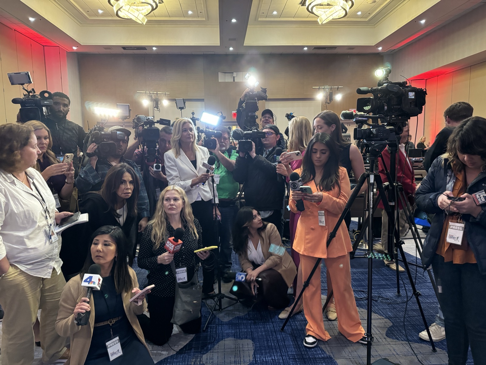 Reporters and TV camera crews packed shoulder to shoulder in a hotel ballroom press scrum at a Steve Garvey campaign event